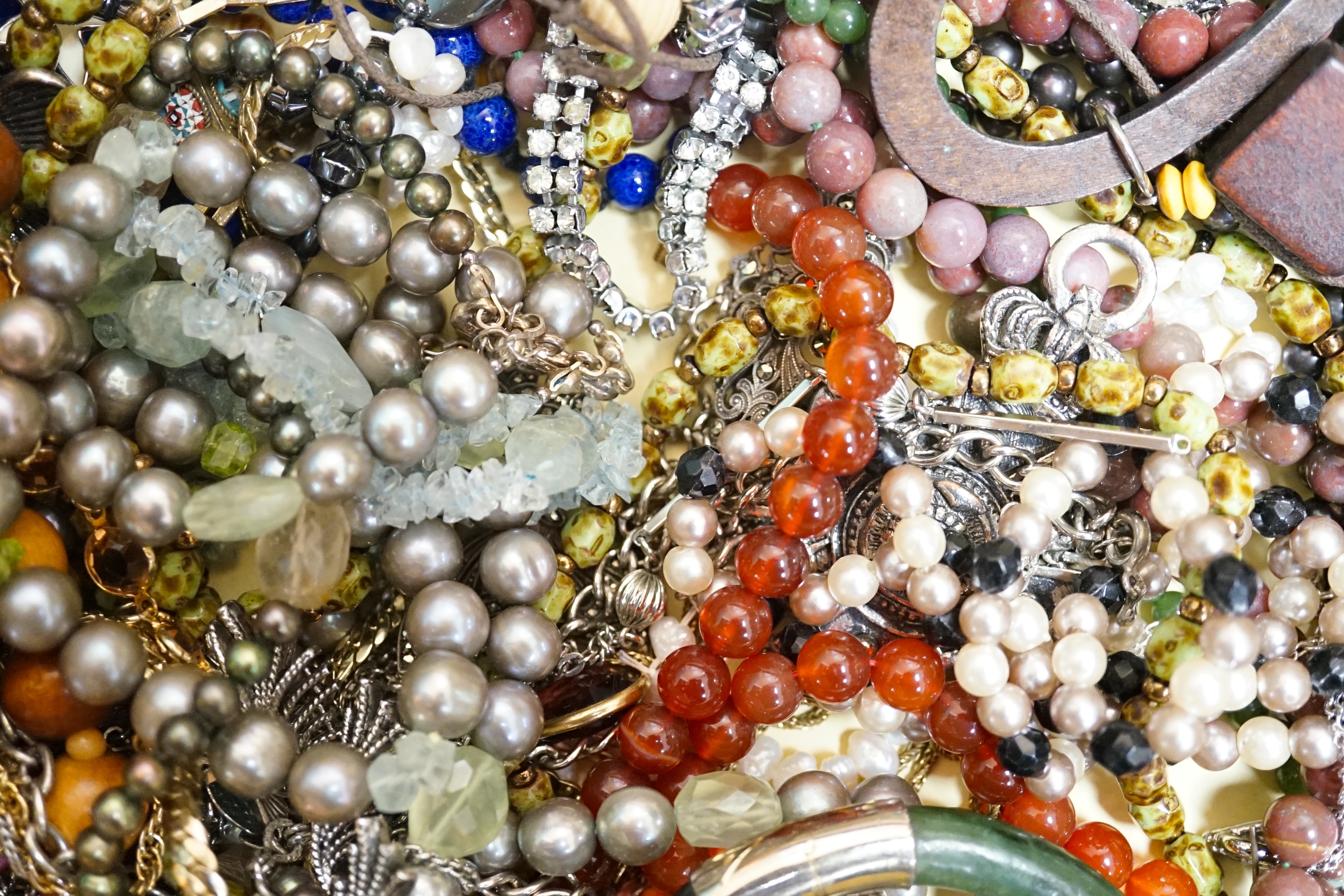 A quantity of assorted costume jewellery. Condition - poor to fair to good